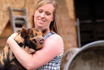 Kelly Worthington holding pig