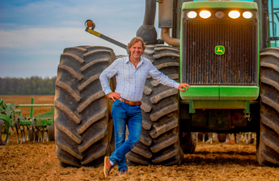 Mark Lumley beside a tractor