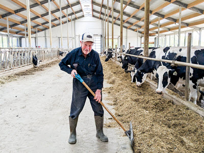 Mack Emiry Working in Dairy Barn
