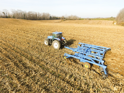 Tractor preparing corn field for seeding