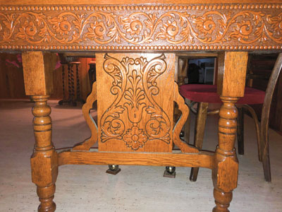 side view of T. Eaton table hand carvings